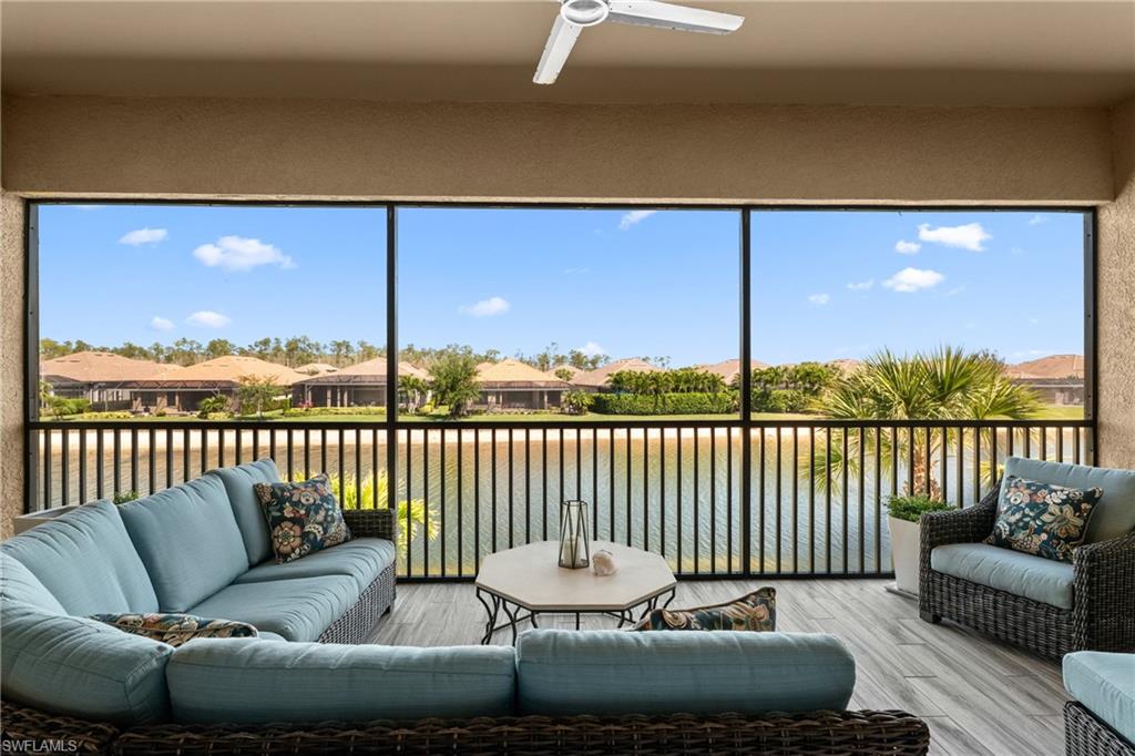 9673 Montelanico Loop, Unit 202 Naples, FL 34119 - Photo 26 of 46 a balcony with furniture and outdoor view