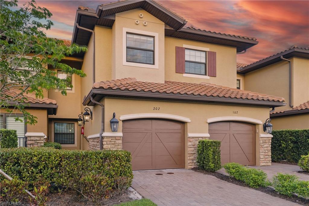 9673 Montelanico Loop, Unit 202 Naples, FL 34119 - Photo 4 of 46 front view of a house