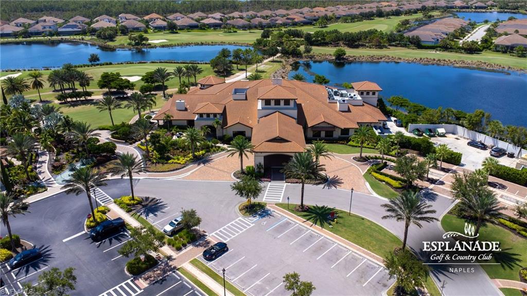 9673 Montelanico Loop, Unit 202 Naples, FL 34119 - Photo 44 of 46 an aerial view of a house with a swimming pool yard and outdoor seating
