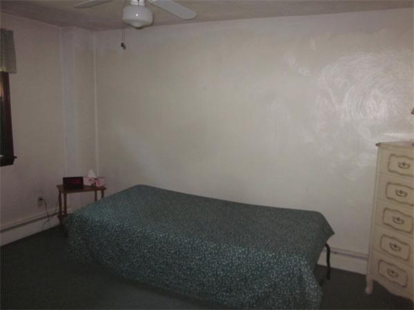 10 Pillings Road Saugus, MA 01906 - Photo 11 of 13 a view of a room with a chair and a table