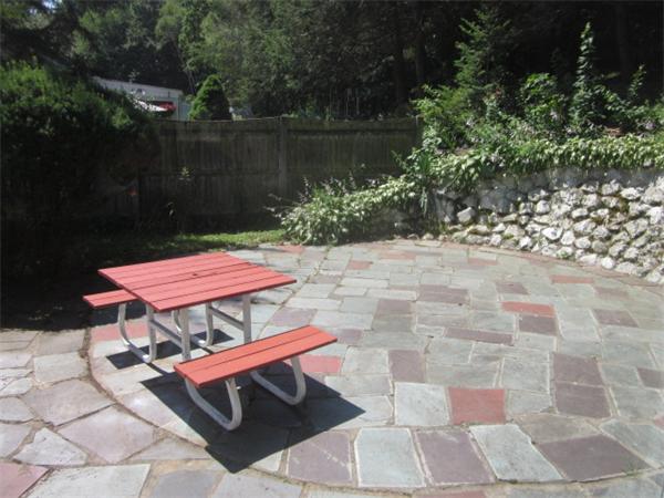 10 Pillings Road Saugus, MA 01906 - Photo 13 of 13 a backyard of a house with yard and outdoor seating