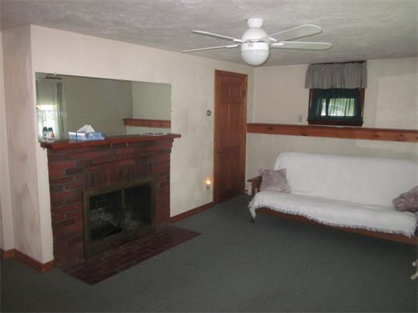 10 Pillings Road Saugus, MA 01906 - Photo 10 of 13 a living room with furniture and a fireplace