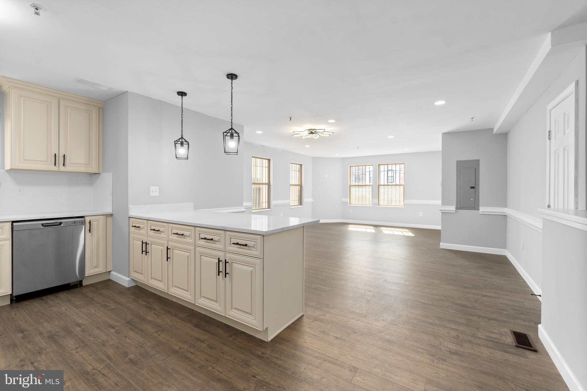 1829 Providence Street Northeast, Unit B Washington, DC 20002 - Photo 13 of 37 a large kitchen with lot of wooden floors and white cabinets