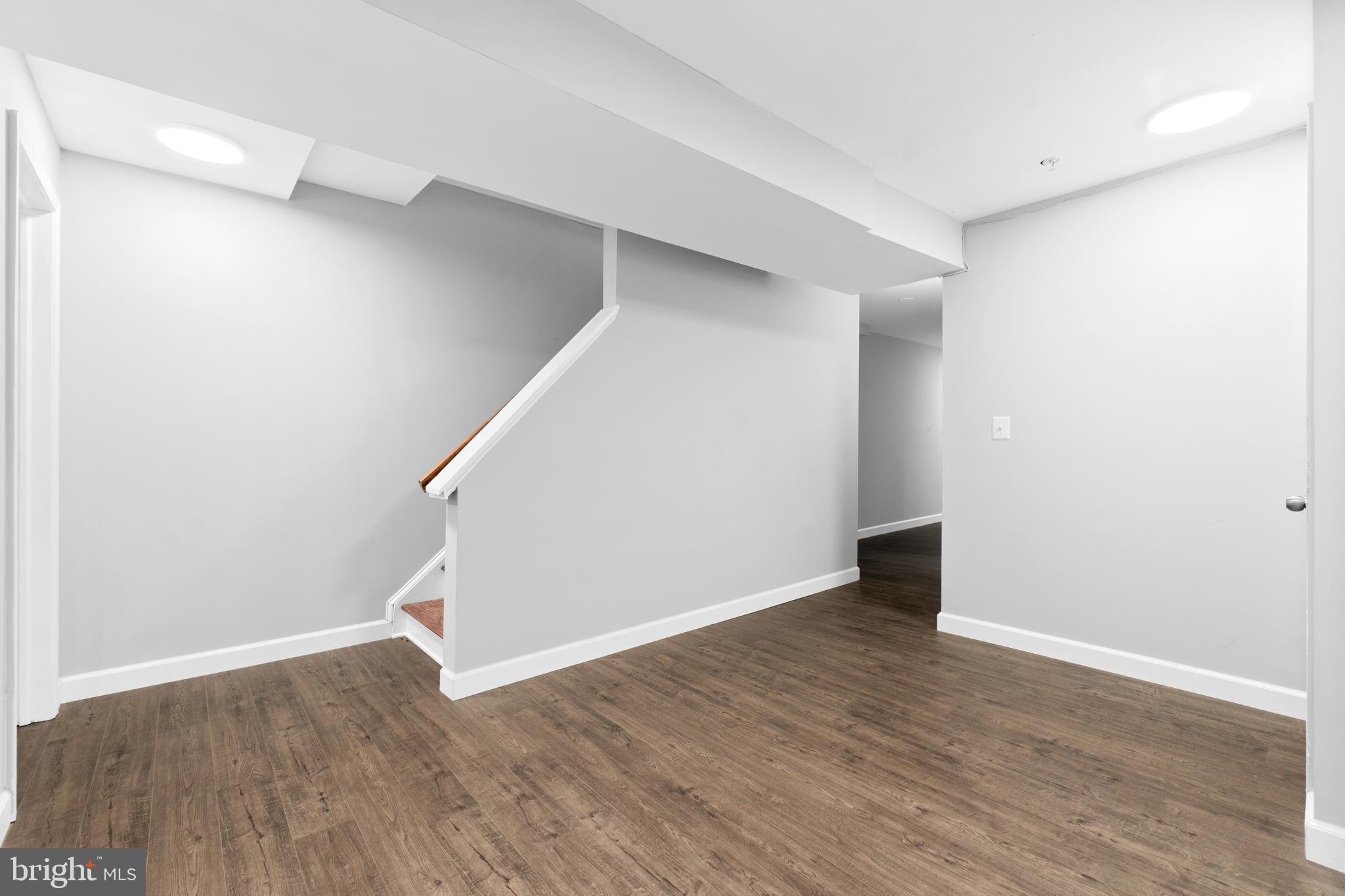 1829 Providence Street Northeast, Unit B Washington, DC 20002 - Photo 19 of 37 a view of an empty room with wooden floor