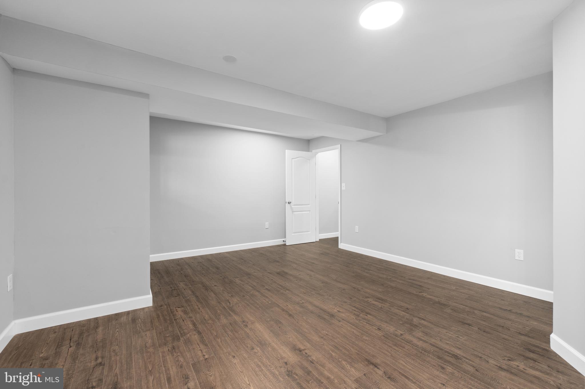 1829 Providence Street Northeast, Unit B Washington, DC 20002 - Photo 25 of 37 a view of an empty room with wooden floor