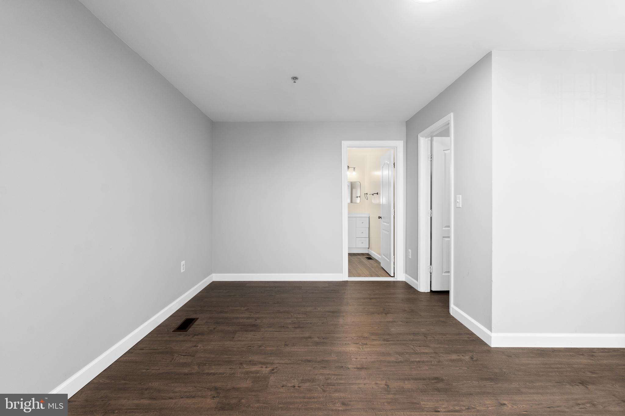 1829 Providence Street Northeast, Unit B Washington, DC 20002 - Photo 28 of 37 a view of an empty room with wooden floor