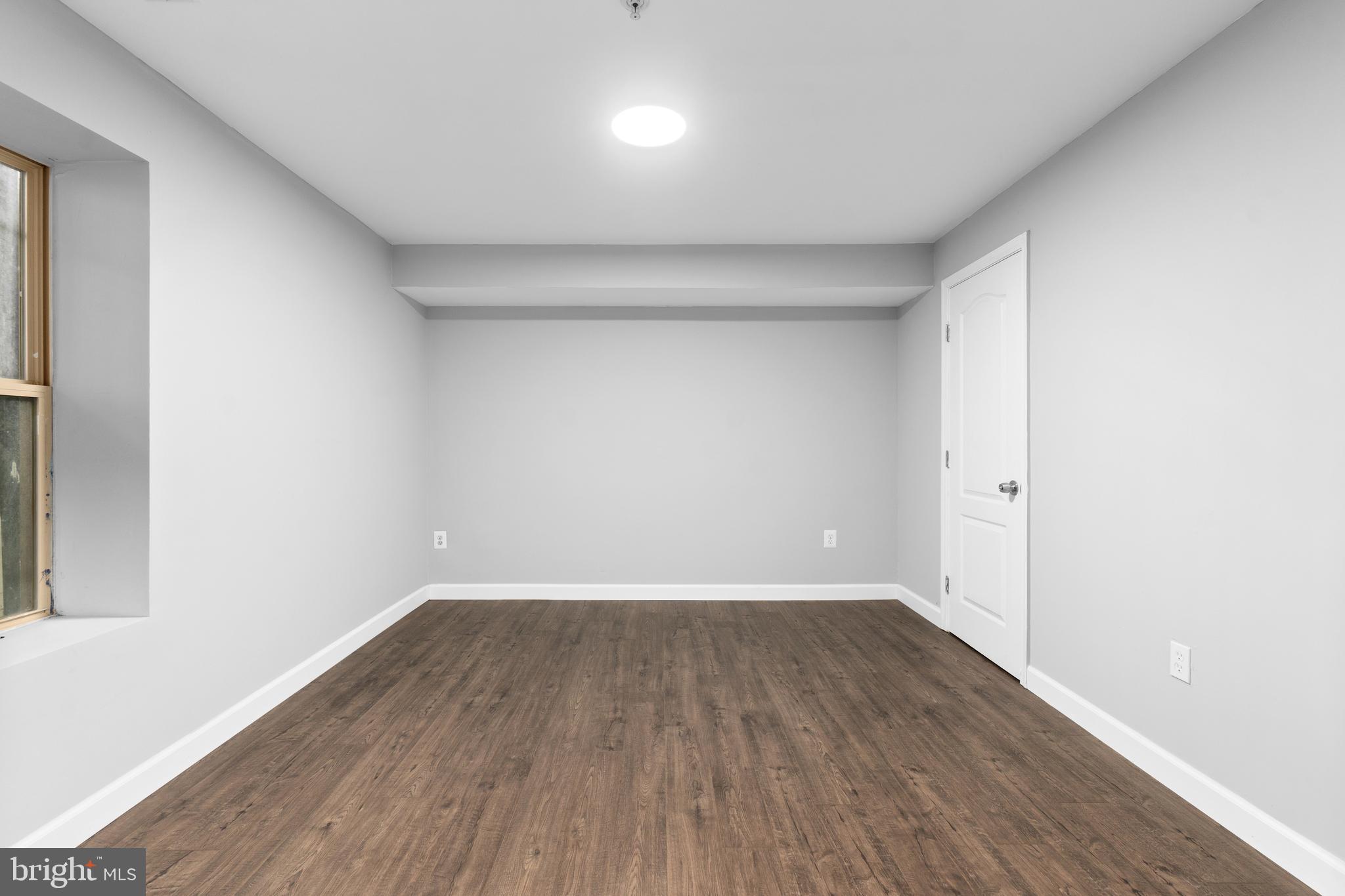 1829 Providence Street Northeast, Unit B Washington, DC 20002 - Photo 29 of 37 a view of a room with wooden floor