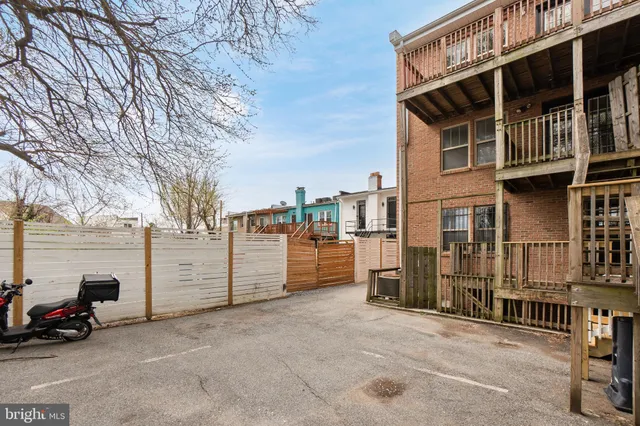a view of a parking space in front of a building
