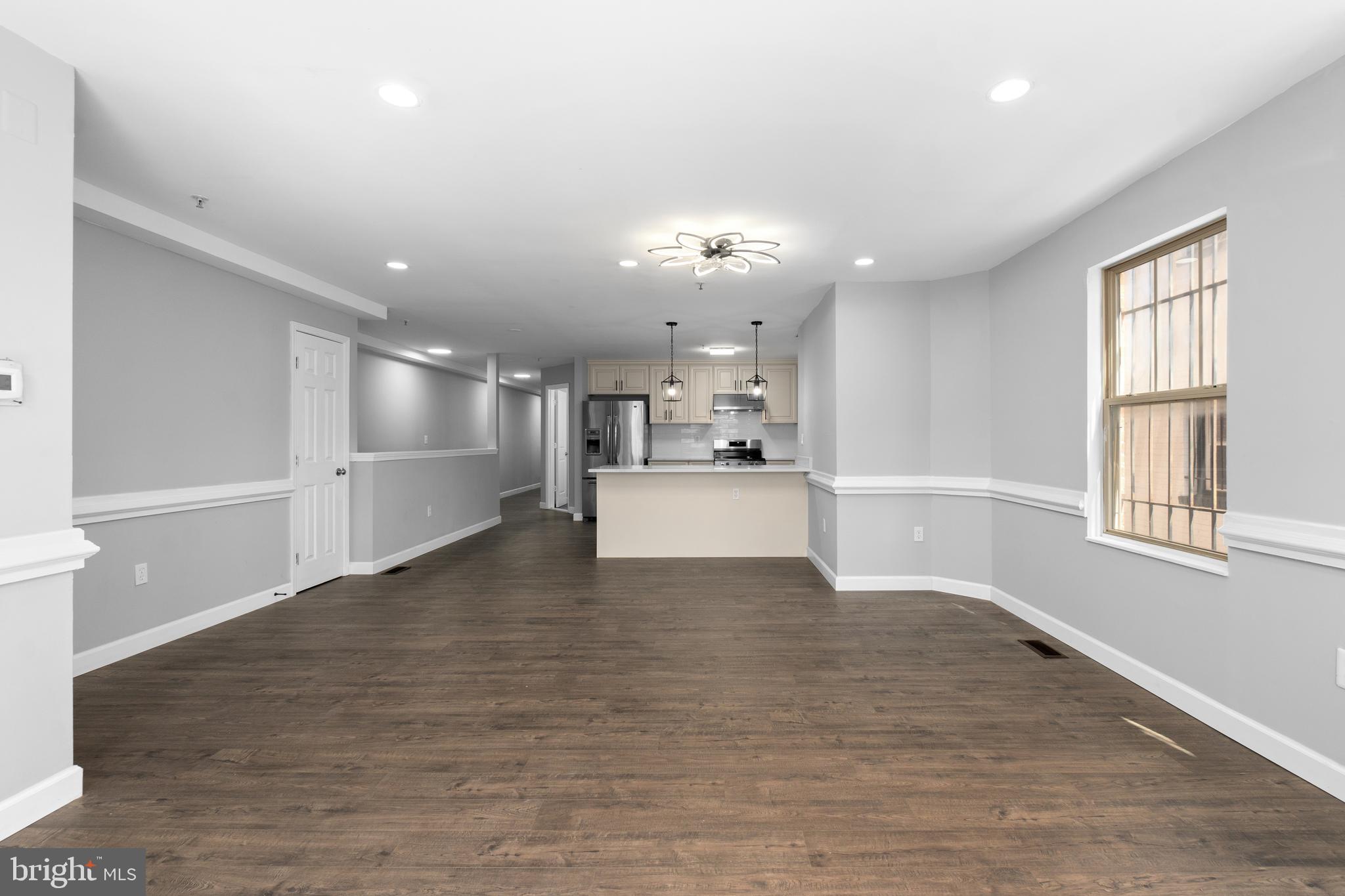 1829 Providence Street Northeast, Unit B Washington, DC 20002 - Photo 8 of 37 a view of a kitchen with wooden floor and a kitchen