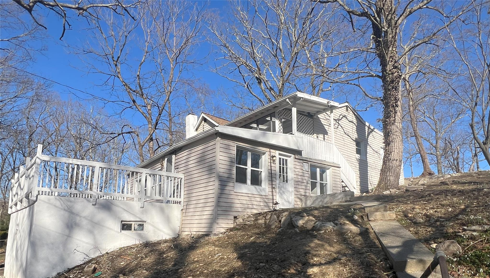 View of property exterior with a deck