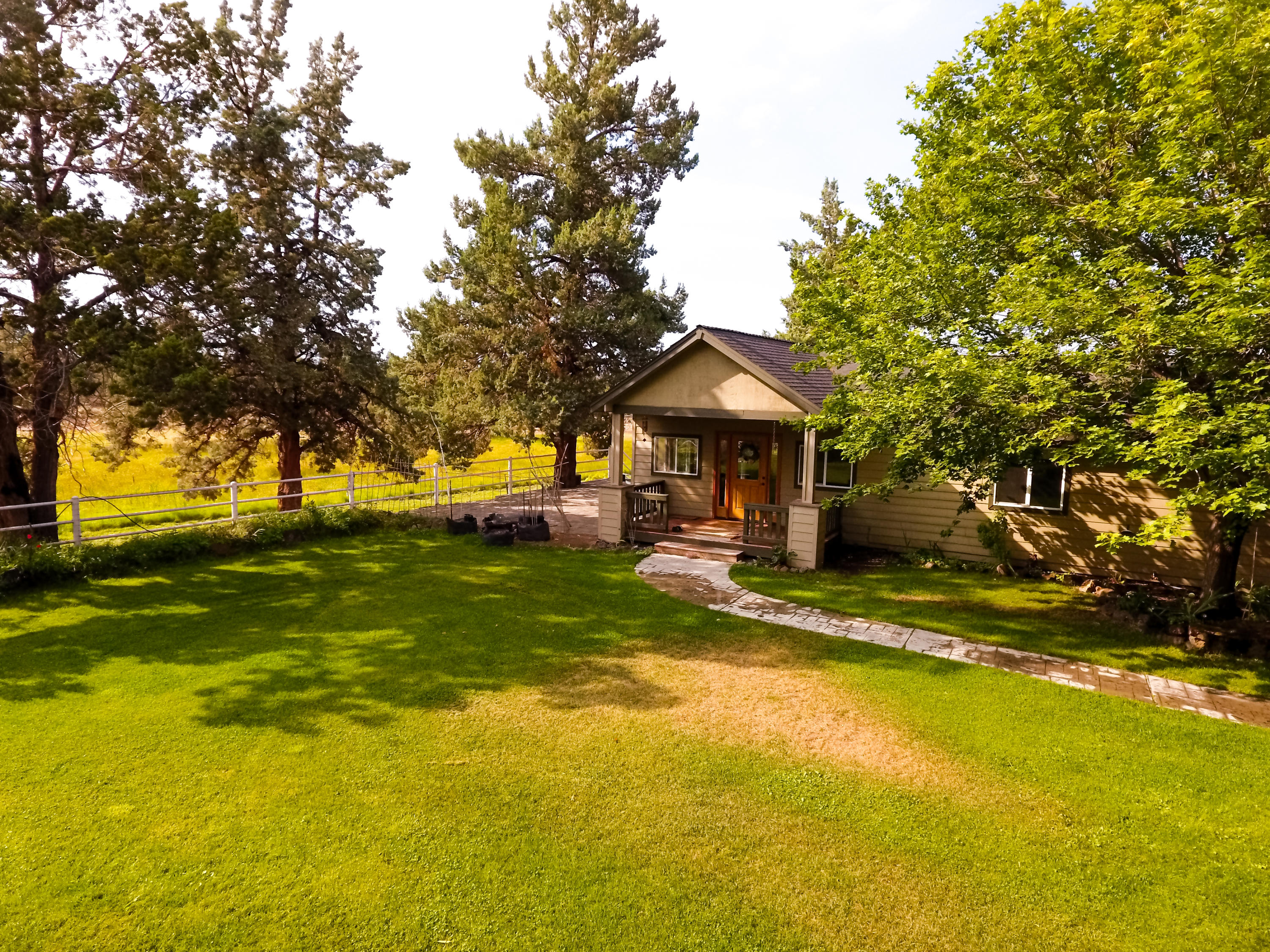 22810 Nelson Road Bend, OR 97701 - Photo 2 of 43 a view of a house with a swimming pool