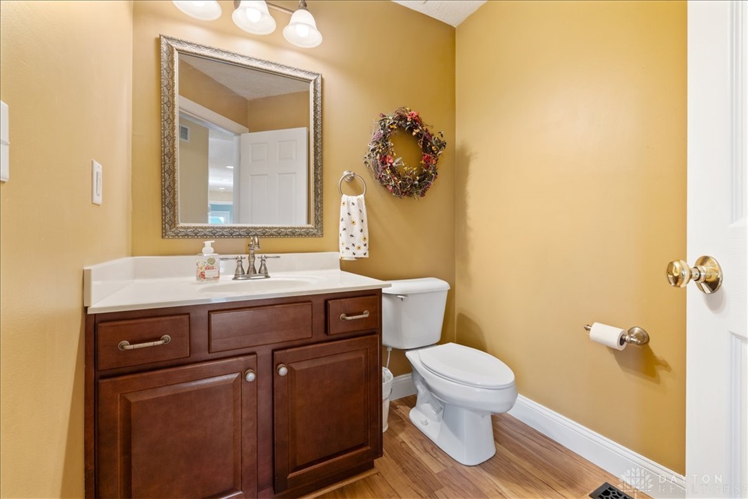 841 Willow Road Springfield, OH 45502 - Photo 14 of 64 This bathroom features a sleek vanity and modern toilet, creating a functional and elegant space.