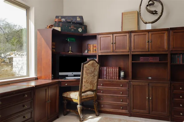 a view of a chair and table in a kitchen