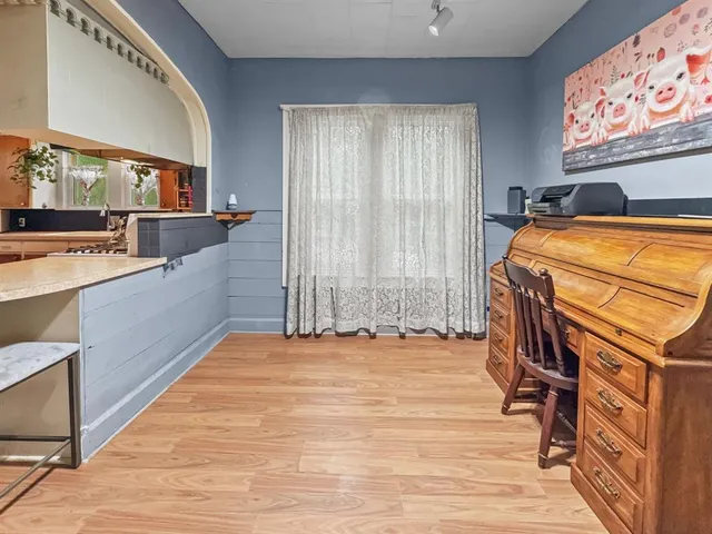 a bedroom with a bed and a view of walk in closet