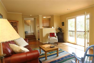 11 Crest Road Ross, CA 94960 - Photo 6 of 11 a living room with furniture a rug and a floor to ceiling window