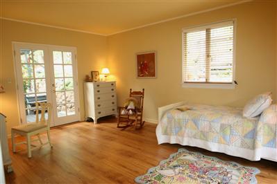 11 Crest Road Ross, CA 94960 - Photo 9 of 11 a bedroom with a bed a table and a large window