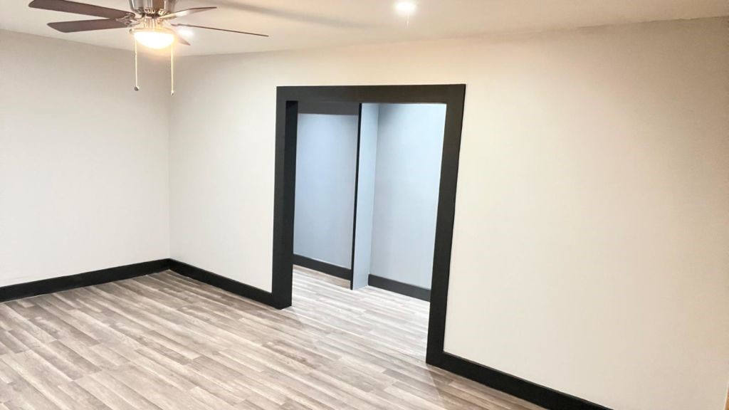 5606 Lyden Ridge Drive Houston, TX 77053 - Photo 25 of 34 a view of a room with wooden floor