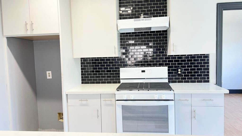 5606 Lyden Ridge Drive Houston, TX 77053 - Photo 29 of 34 a stove top oven sitting inside of a kitchen