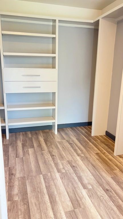 5606 Lyden Ridge Drive Houston, TX 77053 - Photo 3 of 34 a view of walk in closet with empty racks