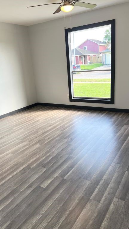 5606 Lyden Ridge Drive Houston, TX 77053 - Photo 32 of 34 a view of a room with wooden floor