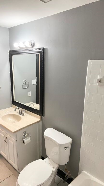 5606 Lyden Ridge Drive Houston, TX 77053 - Photo 34 of 34 a bathroom with a granite countertop toilet a sink and mirror
