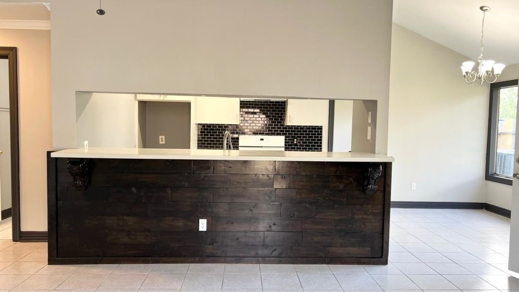 5606 Lyden Ridge Drive Houston, TX 77053 - Photo 6 of 34 a kitchen with kitchen island granite countertop a refrigerator and a sink