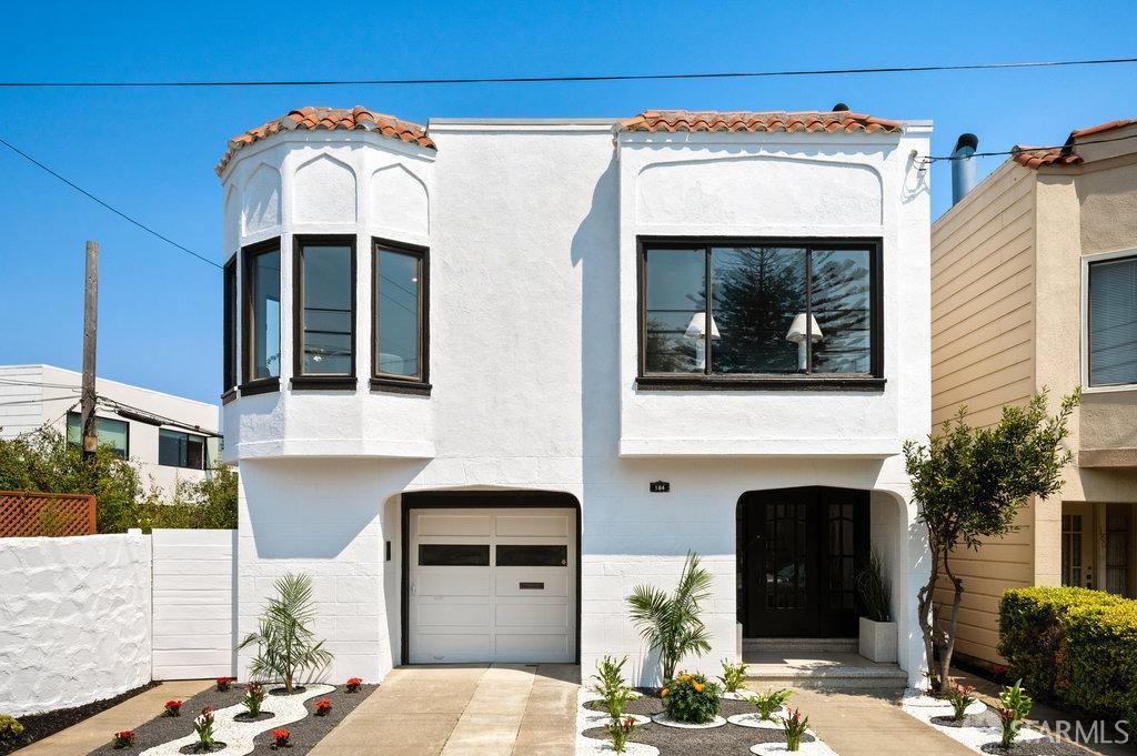 184 Santa Rosa Avenue San Francisco, CA 94112 - Photo 1 of 46 a front view of a house with a garage