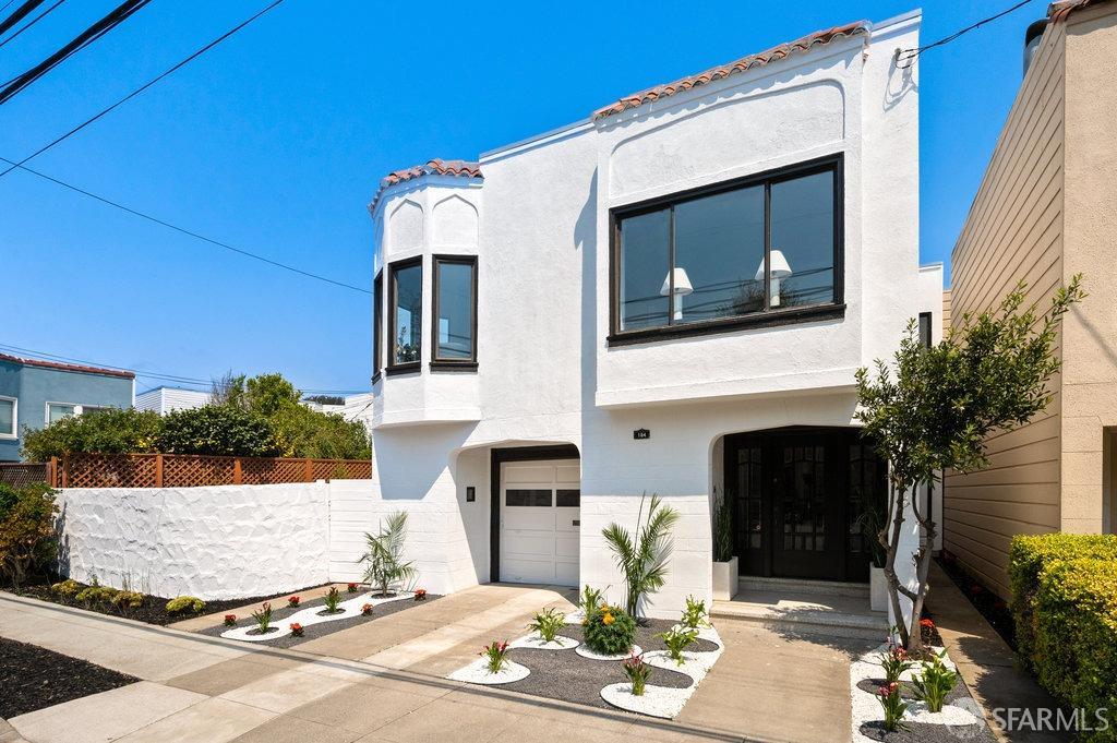 184 Santa Rosa Avenue San Francisco, CA 94112 - Photo 3 of 46 a front view of a house with a yard