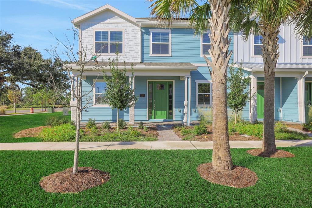 6503 Trailblaze Bend St. Cloud, FL 34771 - Photo 1 of 7 a house with a garden and plants