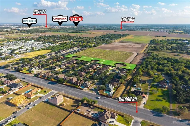an aerial view of a house with a lake view