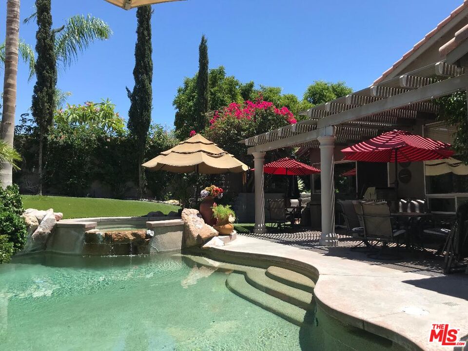 248 Corte Sole Palm Desert, CA 92260 - Photo 3 of 29 a view of a house with a yard patio and fire pit