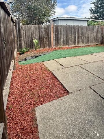 a view of a house with wooden fence