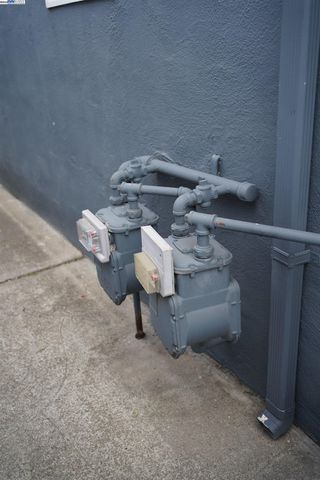 a bathroom with a sink a light fixture and a mirror