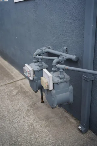 a bathroom with a sink a light fixture and a mirror