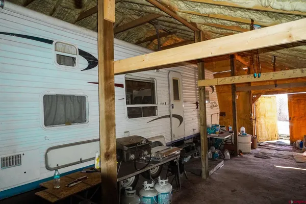 a view of a field with a mountain in the background