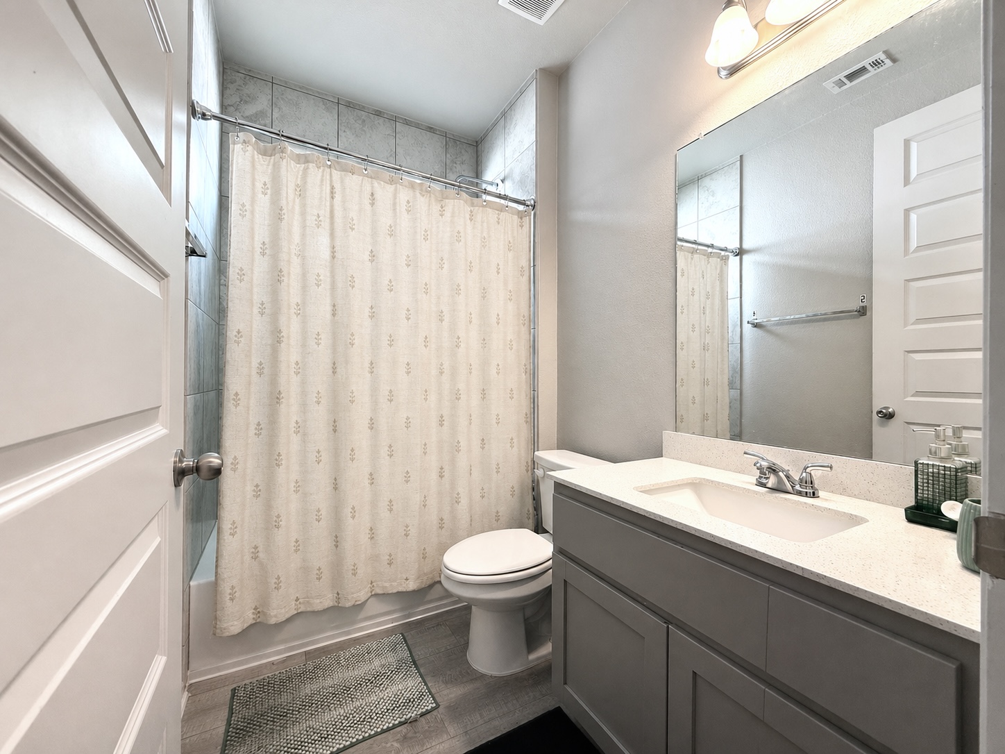 133 Fabion Street Kyle, TX 78640 - Photo 11 of 17 a bathroom with a sink a toilet and shower