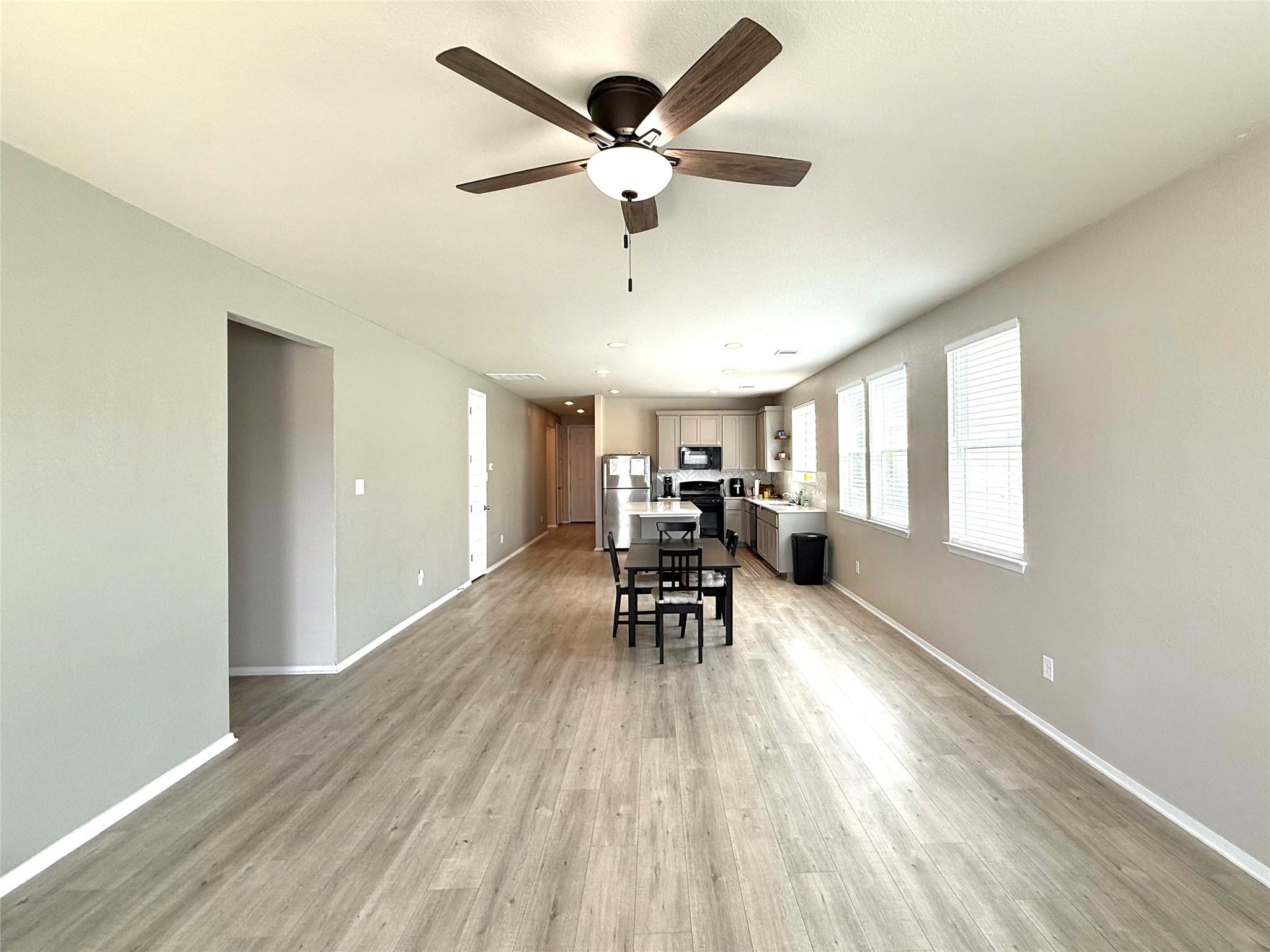 133 Fabion Street Kyle, TX 78640 - Photo 4 of 17 a living room with furniture and a large window