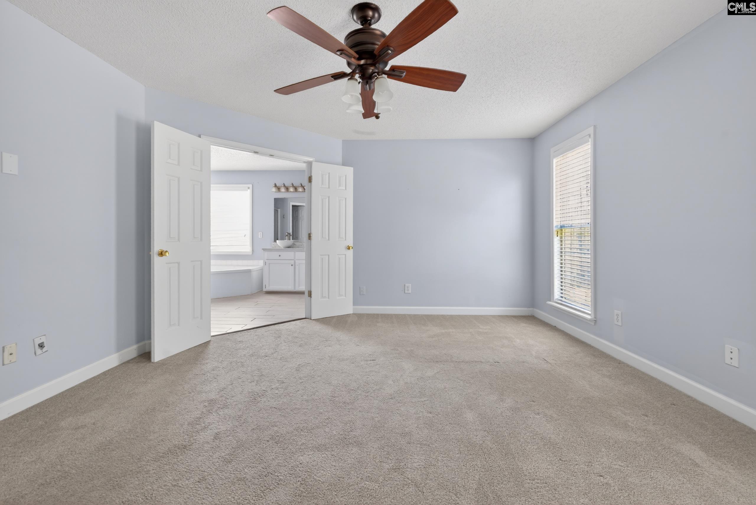 219 Plantation Pointe Drive Elgin, SC 29045 - Photo 26 of 56 wooden floor in an empty room with a window
