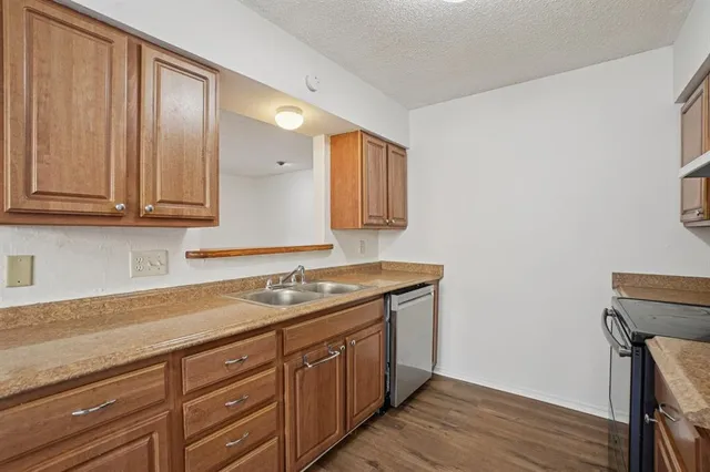 a spacious bathroom with a granite countertop sink and a mirror