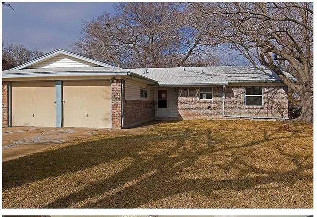 a front view of a house with yard