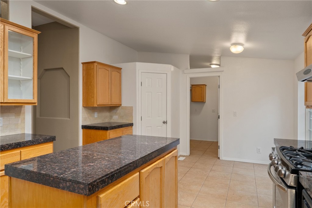 17 Weiss Hill Road Oroville, CA 95966 - Photo 14 of 35 a kitchen with stainless steel appliances granite countertop a sink and cabinets