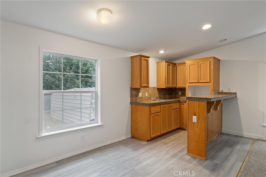 17 Weiss Hill Road Oroville, CA 95966 - Photo 17 of 35 a view of a kitchen with wooden floor and electronic appliances