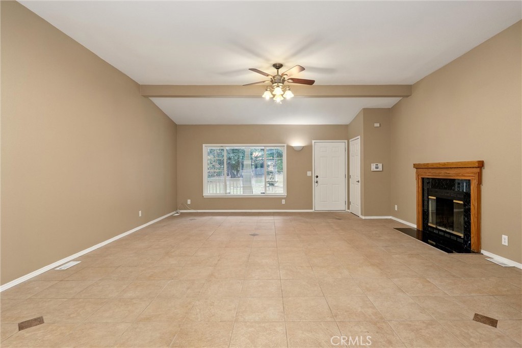 17 Weiss Hill Road Oroville, CA 95966 - Photo 7 of 35 an empty room with windows and fireplace