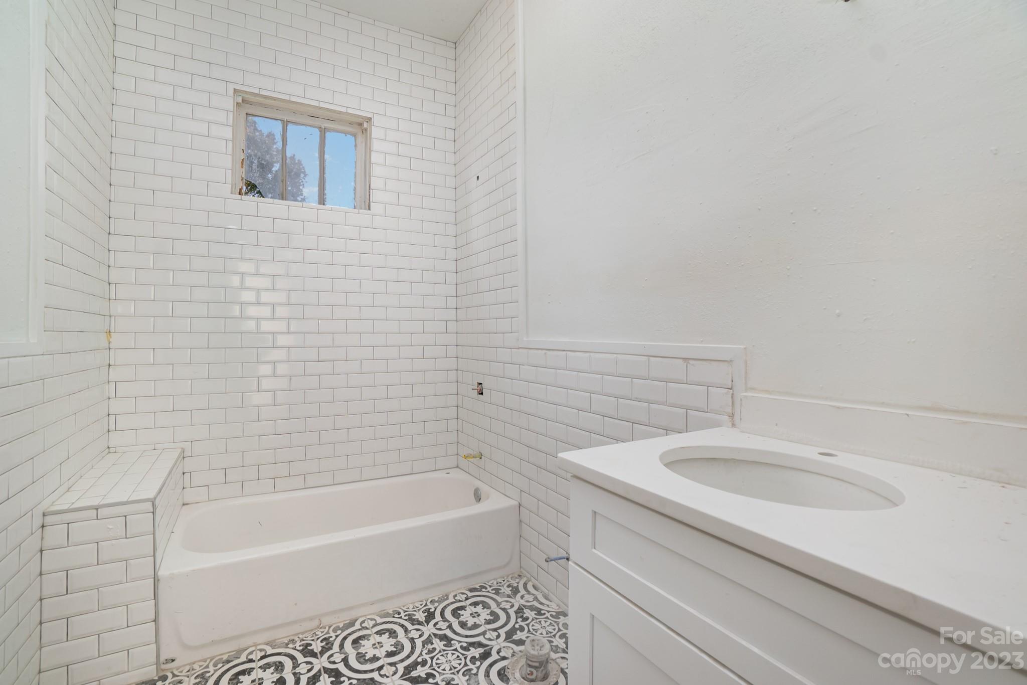 113 Brawley Street Chester, SC 29706 - Photo 16 of 29 a bathroom with a sink a bathtub and a shower