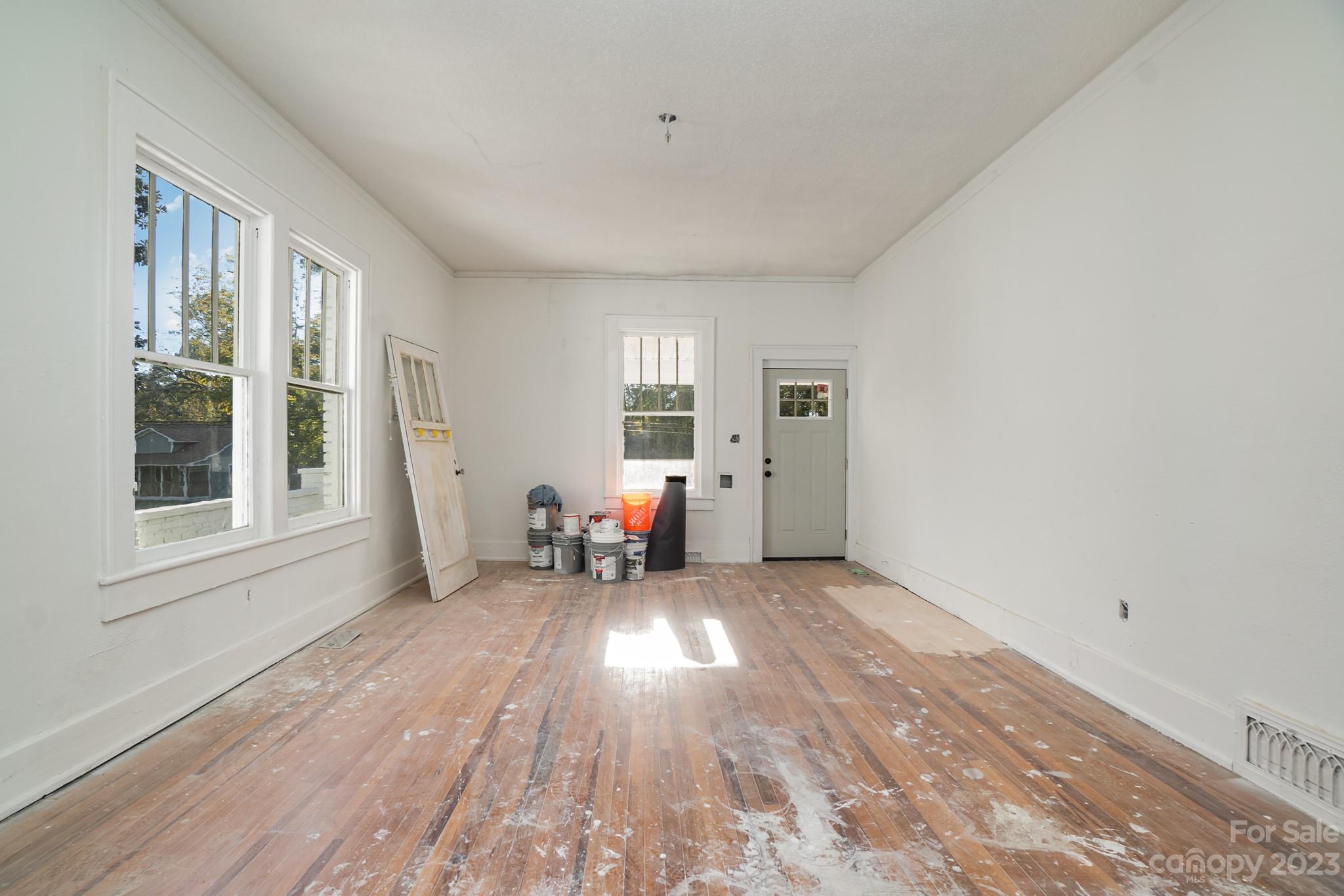 113 Brawley Street Chester, SC 29706 - Photo 23 of 29 a view of a livingroom with wooden floor and window