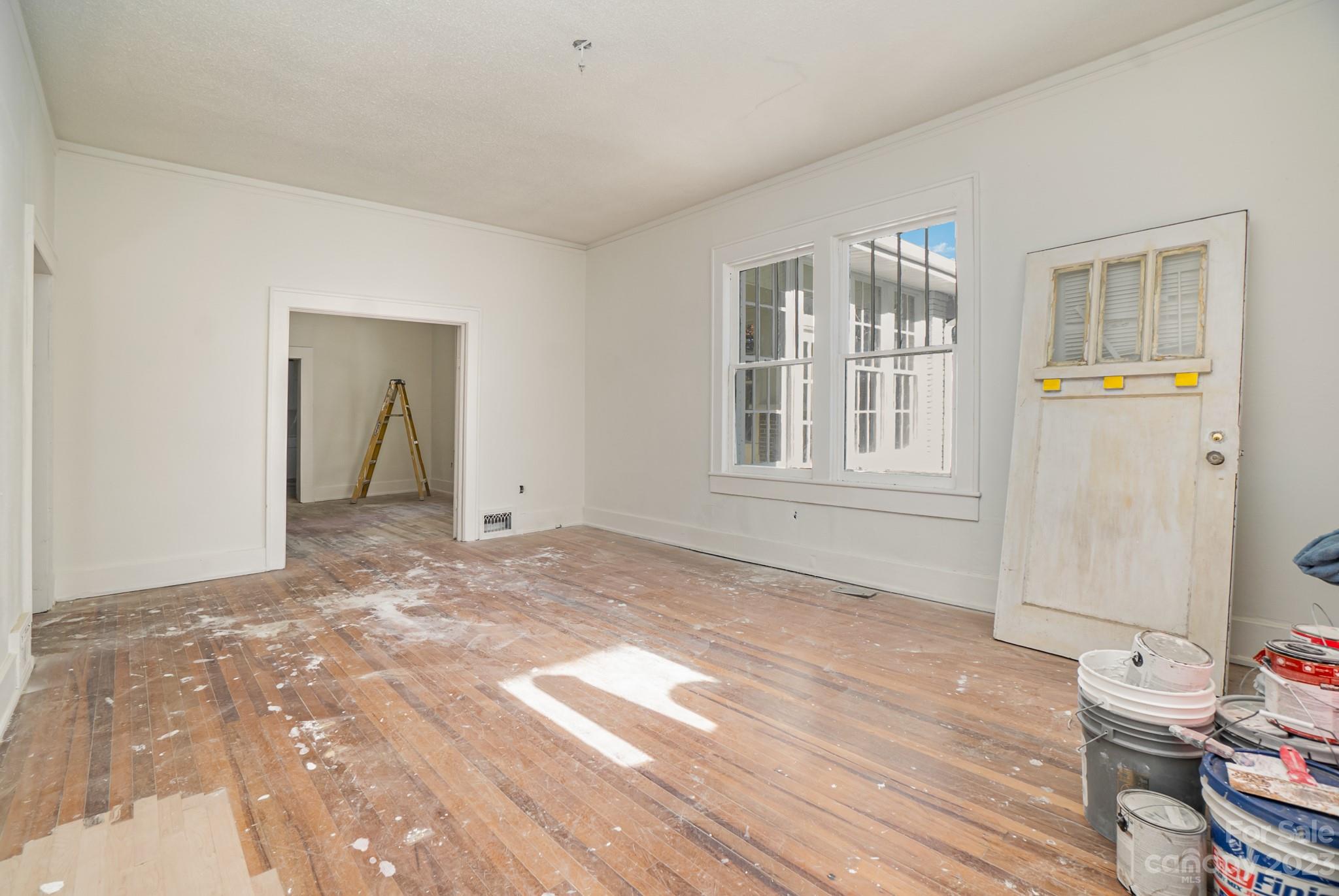 113 Brawley Street Chester, SC 29706 - Photo 24 of 29 a view of an empty room with wooden floor and a window