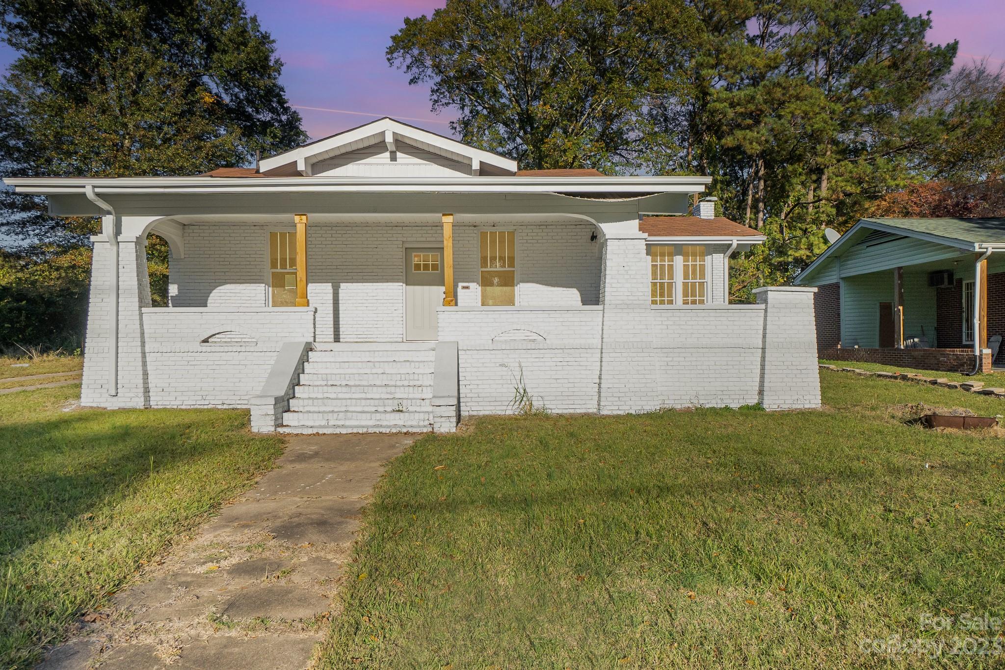 113 Brawley Street Chester, SC 29706 - Photo 27 of 29 a front view of a house with garden