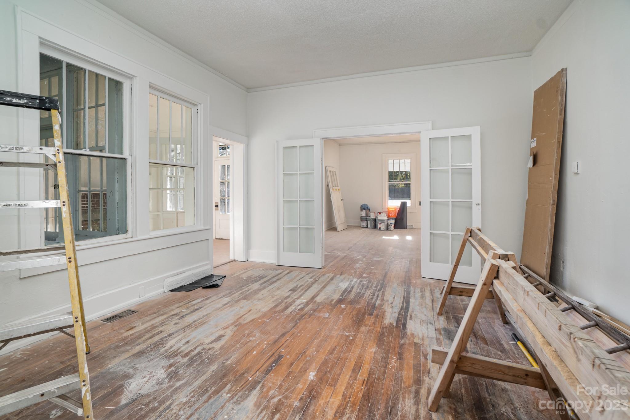 113 Brawley Street Chester, SC 29706 - Photo 8 of 29 a view of a living room and wooden floor