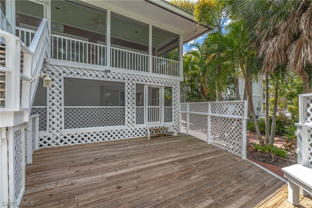 124 Useppa Island Bokeelia, FL 33922 - Photo 19 of 30 a view of a house with a wooden deck