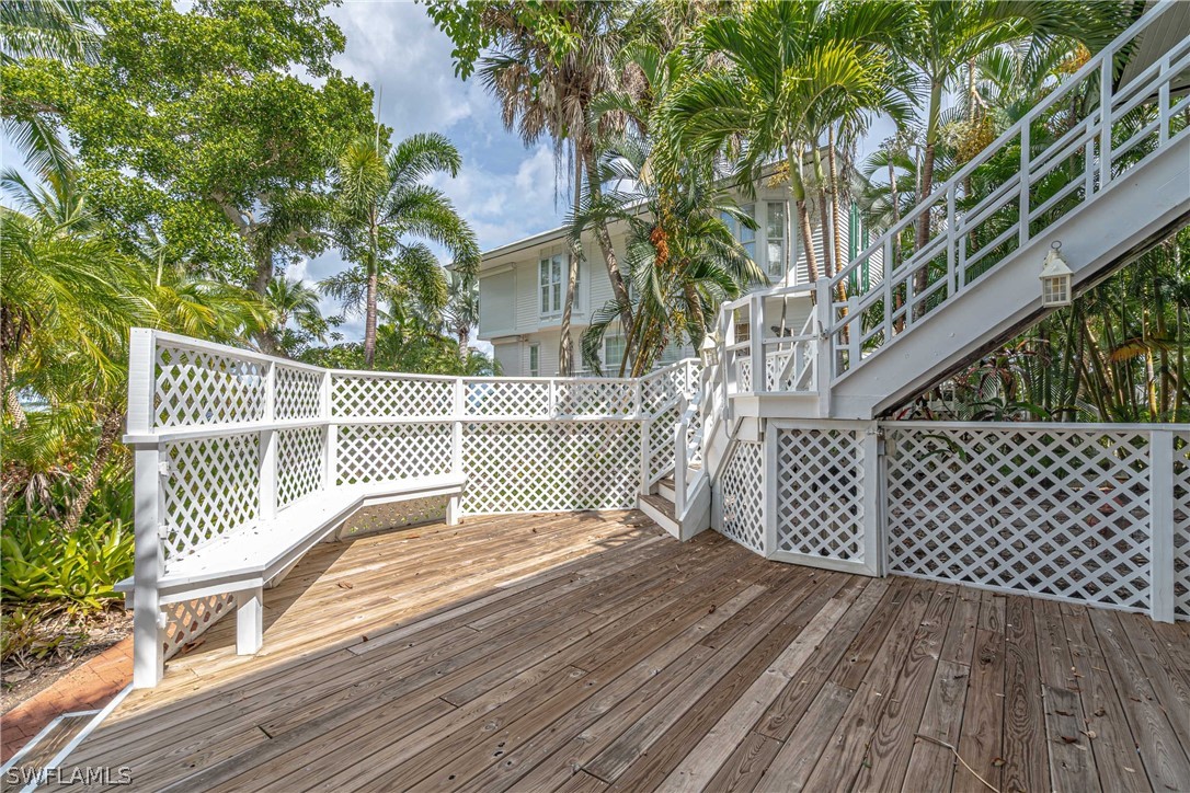 124 Useppa Island Bokeelia, FL 33922 - Photo 20 of 30 a view of a wooden deck with a large trees